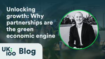 UK100 Blog header featuring 'Unlocking growth: Why partnerships are the green economic engine' with professional headshot of business leader discussing public-private partnerships for local green economic development