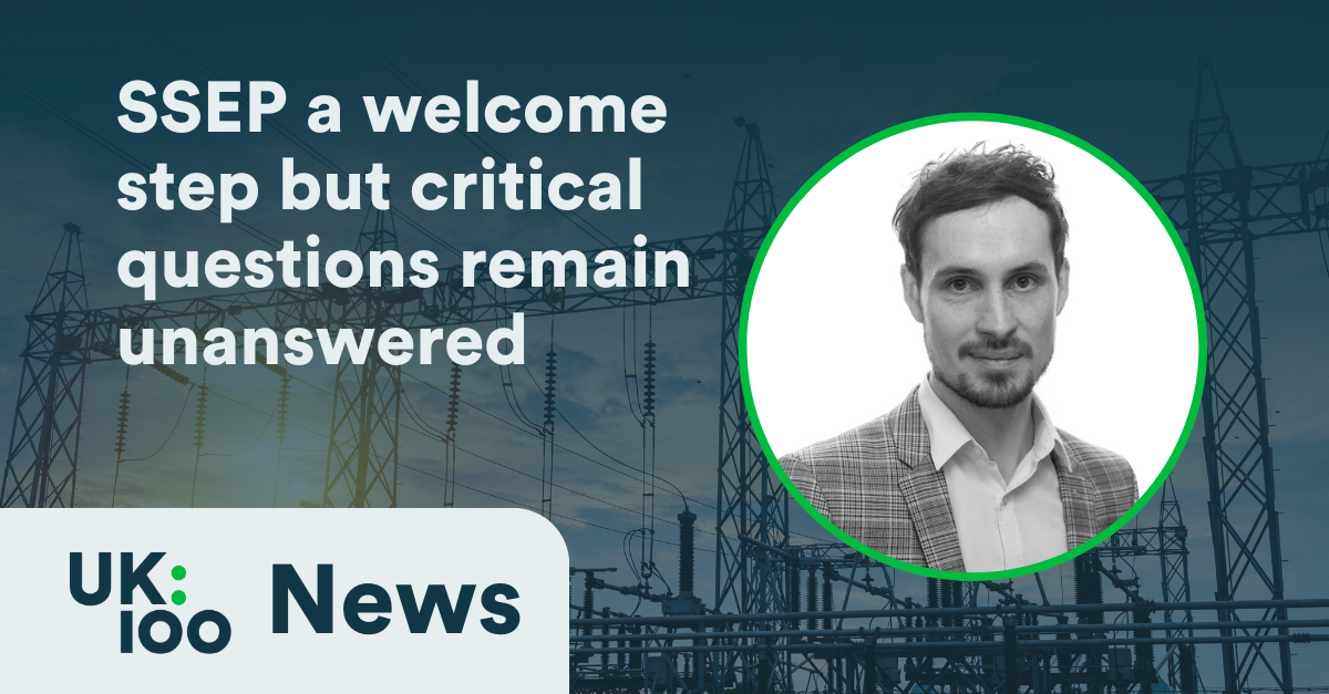 Professional headshot of man in checked blazer against power transmission tower background. White headline reads "SSEP a welcome step but critical questions remain unanswered" with UK:100 News logo.