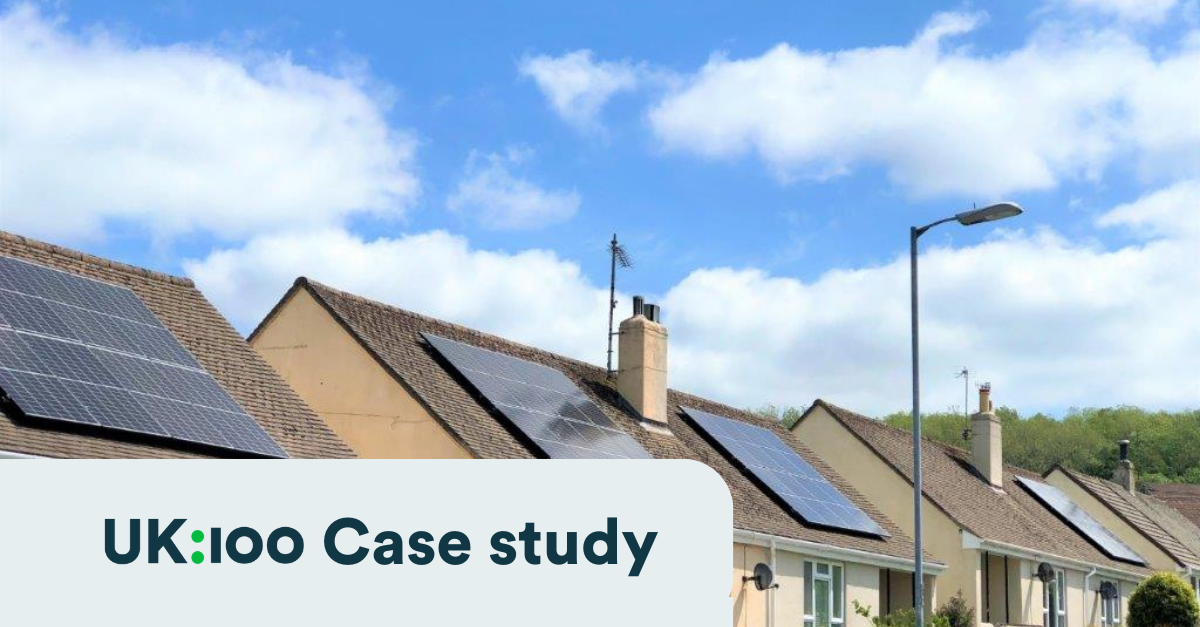 3 detached bungalow new build houses with solar panels in a blue sky with white fluffy clouds